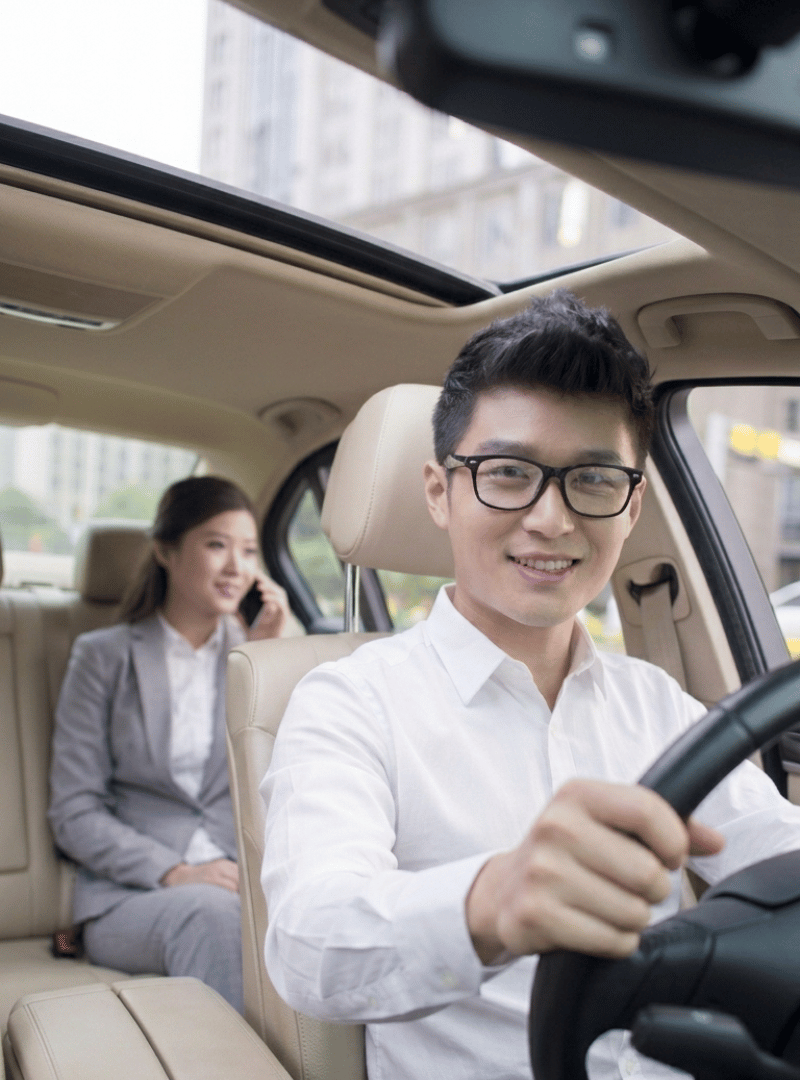Professional Zen Rides chauffeur driving a passenger